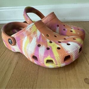 Gently used CROCS clogs in girl or woman size 6, multicolored.